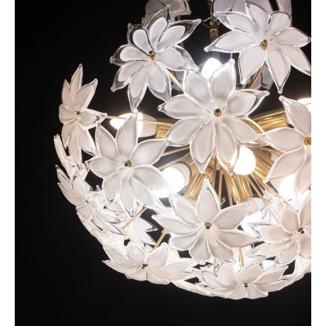 Vintage Murano glass chandelier with glass flowers. Gold bath frame, some small signs of time that gives authenticity and...