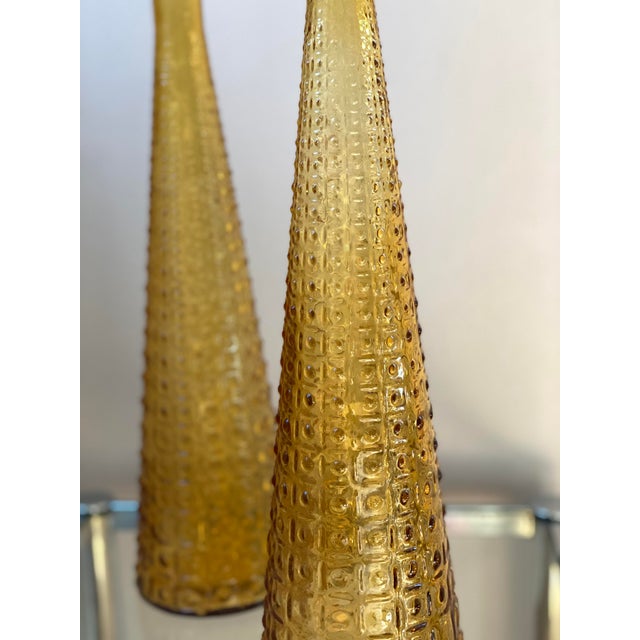 Pair of 22" tall Empoli genie decanter bottles in the amber color of the classic Aztec pattern. MCM Italian art glass made...