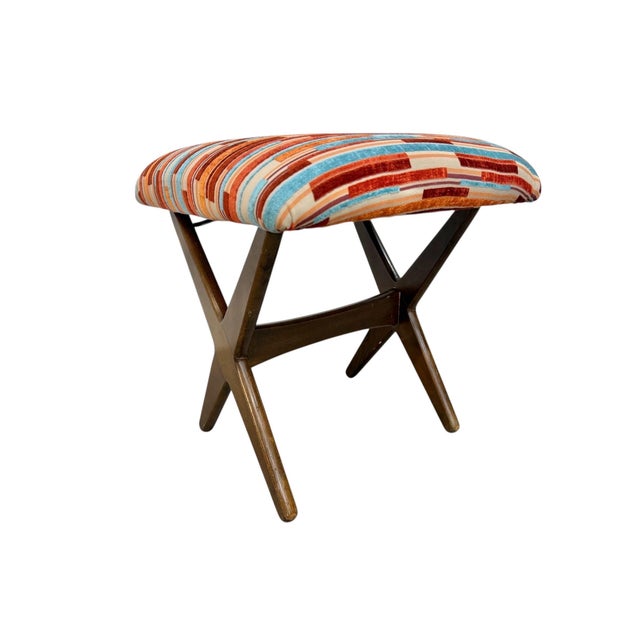 This striking Mid-Century Danish Modern ottoman, attributed to DUX, showcases the clean lines and sculptural craftsmanship...