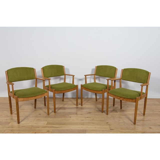 A set of four danish model j62 armchairs designed by poul m. Volther for the danish design cooperative fdb møbler in the...