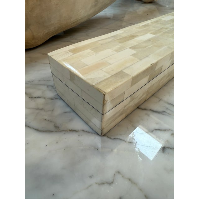 This elegant rectangular box features a refined patchwork of hand-laid cream bone inlay, creating a subtle yet luxurious...