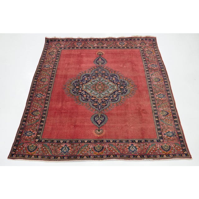 The Terracotta Vintage Persian Tabriz Room Size Wool Rug features an intricate medallion motif, showcasing a rich...