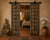 This outstanding door from Gujarat, c. 1880-1900, of 16 small panels per side, has beautiful carved moldings around each...
