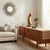 Carved from a single, organic piece of natural timber with rich variations in grain and color, this striking sculpture...