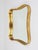 A wonderful Austrian modernist wall mirror with a lovely curved gold-plated lime wood frame from the 1940s. Manufactured...