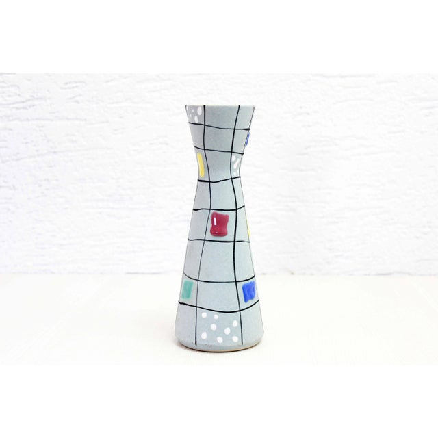 Nice ceramic vase from the 60s and 70s West Germany by Foreign. Ideal for accommodating medium -sized bouquets, this...