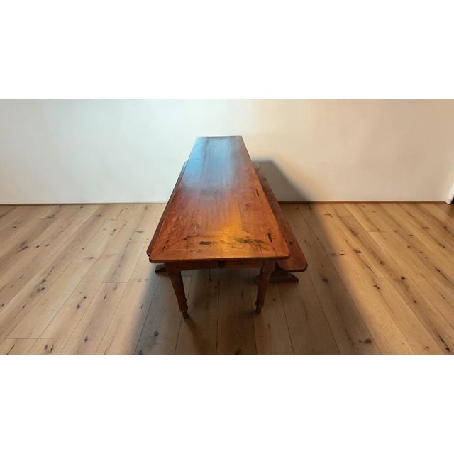 Antique Farmhouse Table and Benches in Cherry Wood, 1850s, Set of 3, in Very Good conditions. Designed before 1890 This...