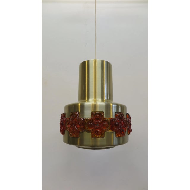 Midcentury pendant lamp by Claus Bolby. Aluminum brass finish with transparent acrylic molded art inlay detail. Beautiful...