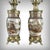 This remarkable pair of Japanese porcelain lamps is distinguished by the extraordinary finesse of its hand-painted...