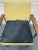 Mid-century modern yellow vinyl and black fabric office chair. Chrome base with wood arms. Some minor tears on the back of...