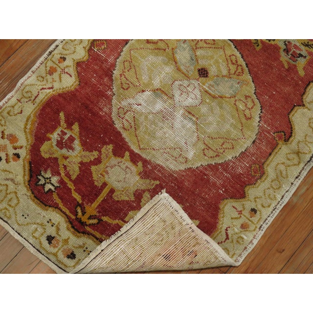 A worn early 20th Century Anatolian Turkish Rug
