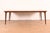 A sleek and stylish Mid-Century Modern sculpted walnut extension dining table By John Van Koert for Drexel, "Profile"...