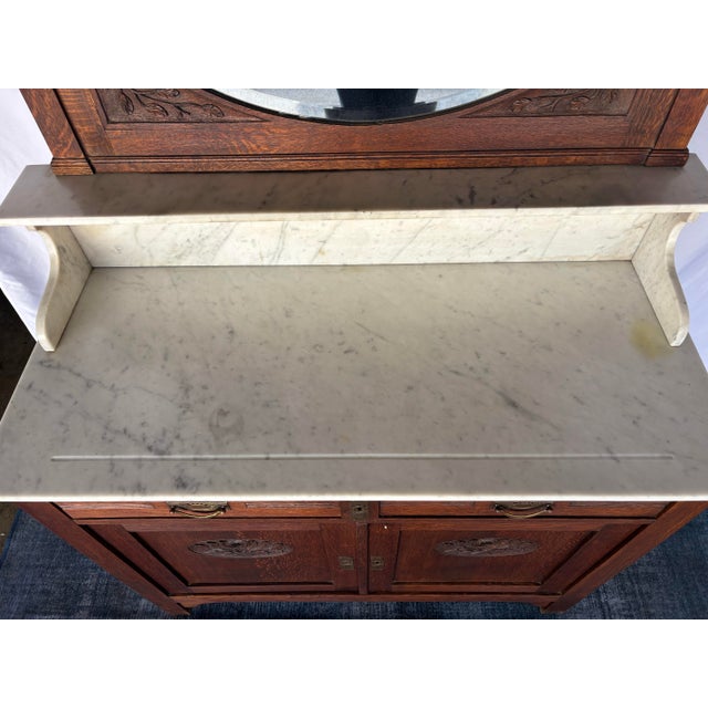 Antique Oak Washstand / Bathroom Vanity With a Marble Top, Oval Beveled Mirror, and Floral Carvings For Sale - Image 4 of 12