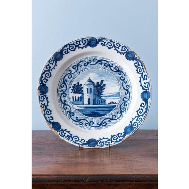 Diameter: 34 cm (each) Height: 5 cm (each) Glaze losses and chips to the edges.