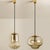 Set of two smoked golden/brown pendant lights, 1960s by peill and putzler in germany, europe. A unique shape and a...