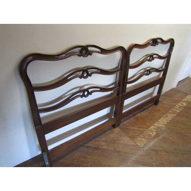 Item 84208: Solid mahogany king size ribbon back headboard. Age: 1960's. Details: Will require the metal frame for setup....