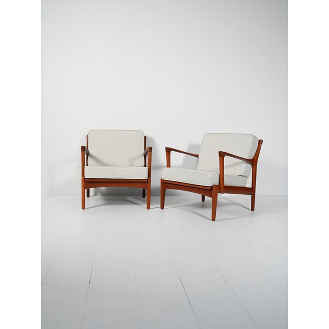 Pair of "Kuba" armchairs by Bertil Fridhagen for Bröderna Anderssons Ekenässjön, 1950s. Carved teak frame, slatted...