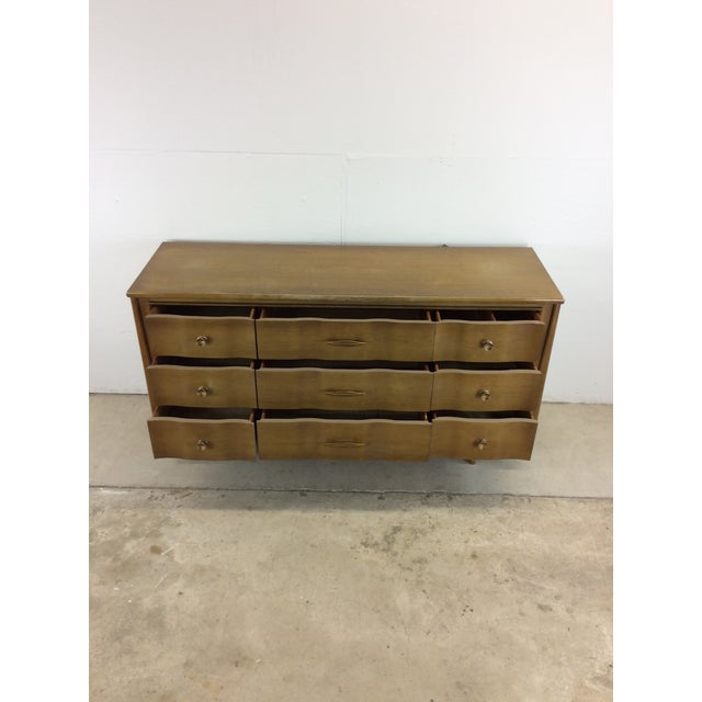 This mid century modern lowboy dresser “The Appleton” by Kent Coffey features hardwood construction, beautiful walnut...