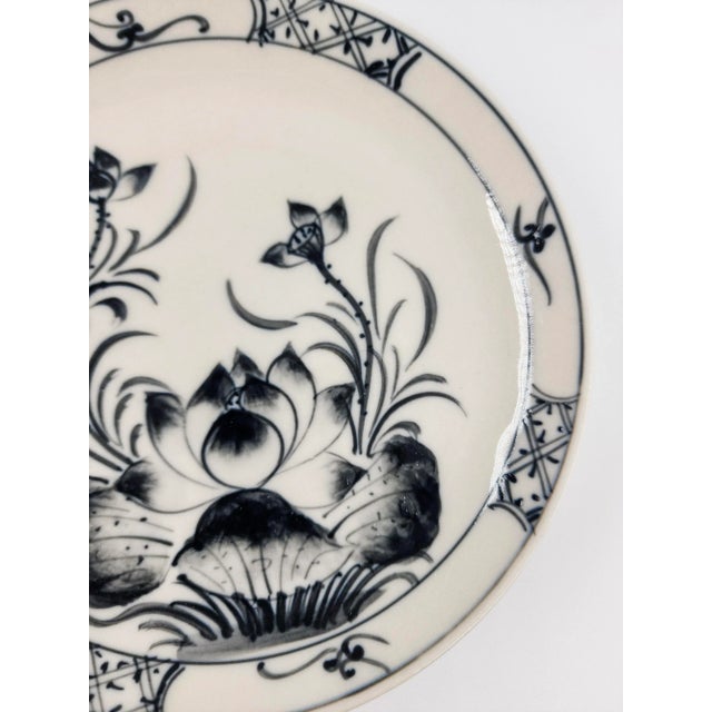 This charming set of six dessert-size plates showcases traditional Vietnamese ceramic artistry in timeless blue and white....