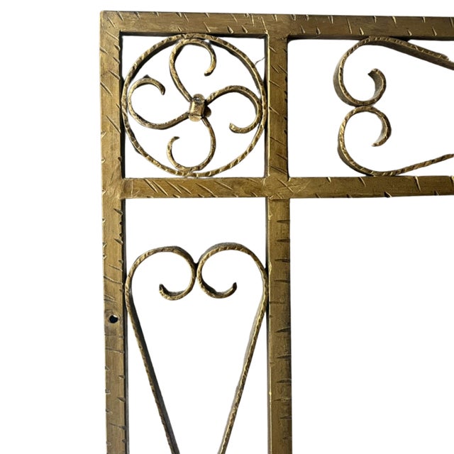An imposing, handcrafted wall mirror, dating from the 1950s or 1960s, embodies the decorative aesthetic of the mid-20th...