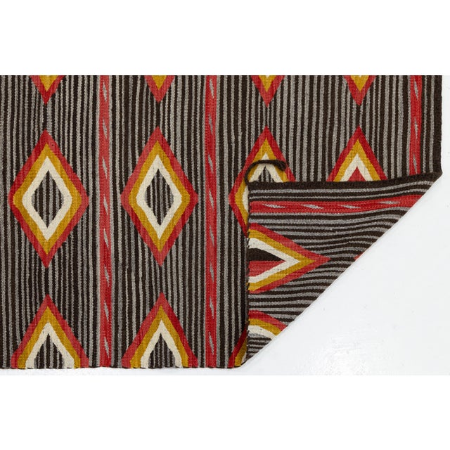 Elevate high-end interiors with this striking contemporary wool rug, featuring a refined modern interpretation of...