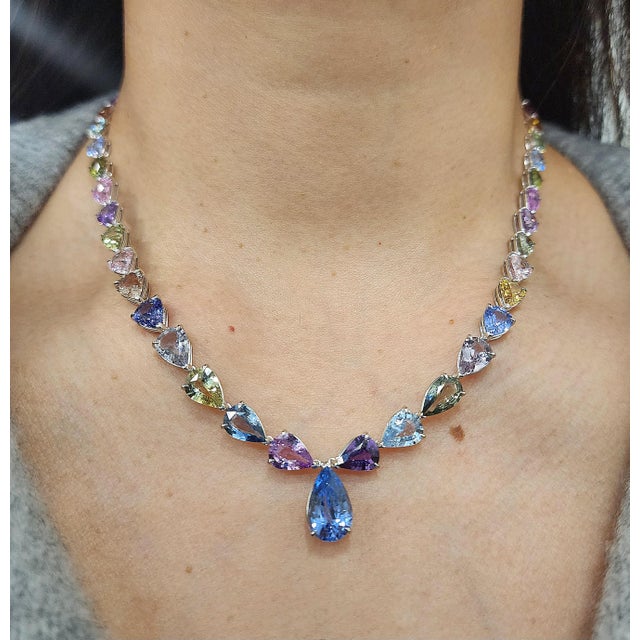 This mesmerizing rainbow sapphire necklace is a striking expression of color and modern elegance, beautifully crafted in...