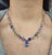 This mesmerizing rainbow sapphire necklace is a striking expression of color and modern elegance, beautifully crafted in...