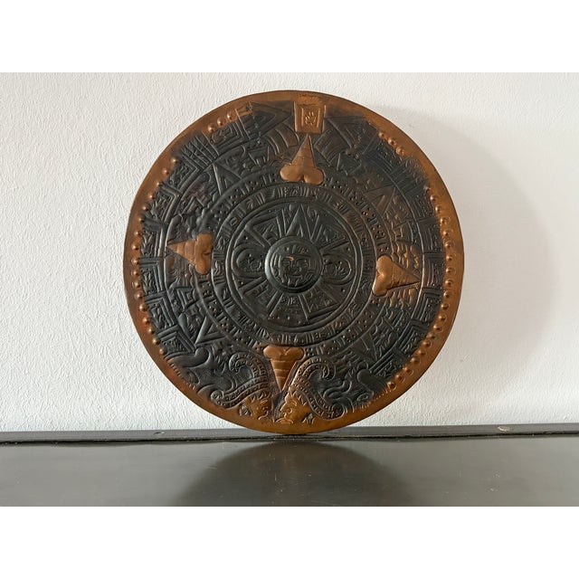 According to internet research, the wall relief is modeled in the Aztec style.