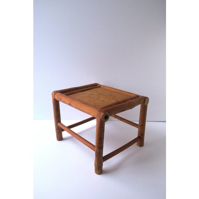 A wicker bamboo pedestal or plant stand, circa mid-20th century, Asia. A great piece to hold books, a drink, a plant,...