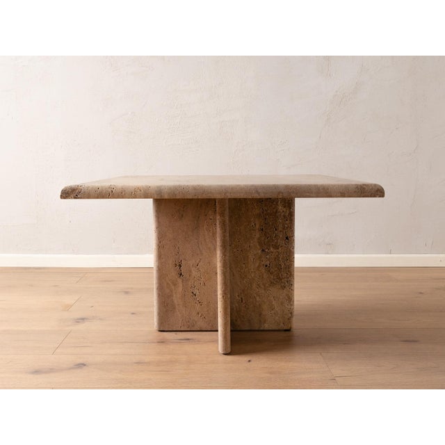 Wonderful travertine coffee table from the 1960s. High-quality table top and base in beige and brown tones. Quality...