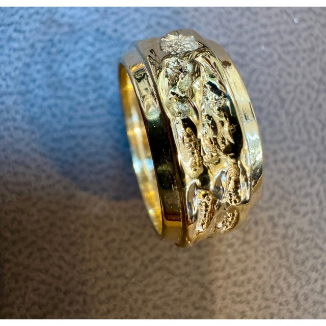 Introducing an 14 Karat Yellow Gold Classic Wide Wedding Band with a unique design, available in a unisex size 4.5. This...
