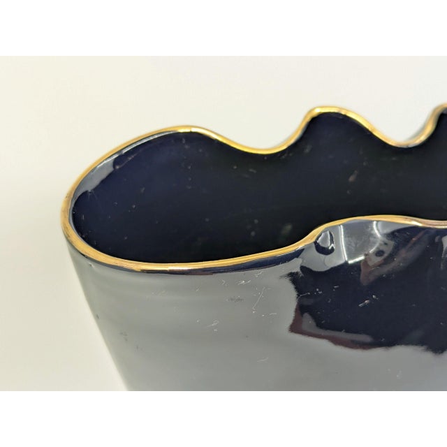 Elegant black ceramic vase with gold decoration, produced in Italy during the first half of the 20th century. Pinpointing...