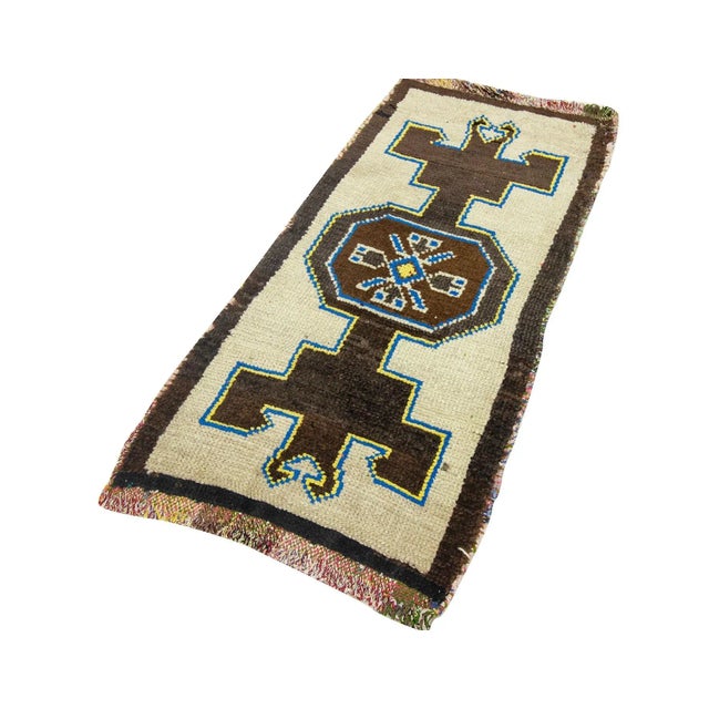 Vintage Handknotted decorative mini rug from Kars region of Turkey. Approximately 45-55 years old. In very good condition.