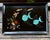 A striking vintage Couroc of Monterey serving tray featuring two whimsical turquoise angel fish swimming across a dramatic...