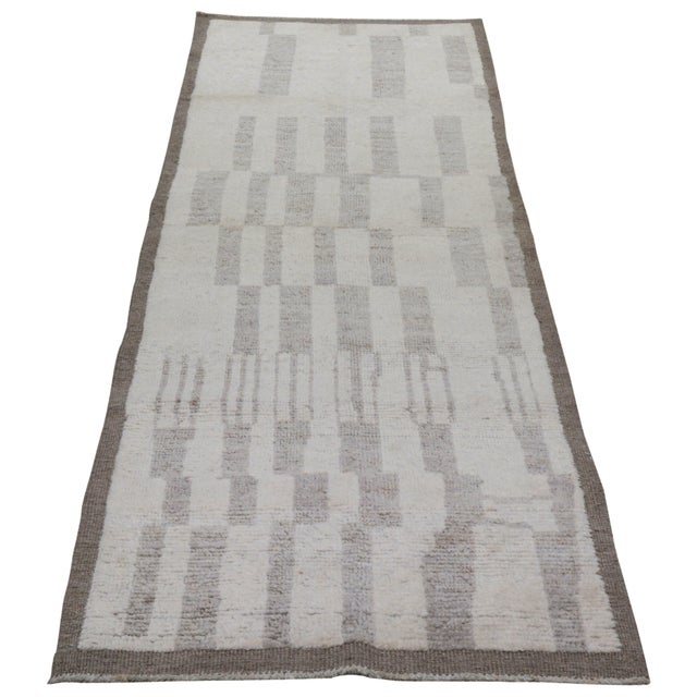 Hand-knotted with care using traditional rug-making techniques, this wool rug blends timeless craftsmanship with a modern...