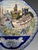MAKKUM (NEW FRISE) Large polychrome decorated earthenware wall plaque depicting a shipyard scene in a Dutch town. The blue...
