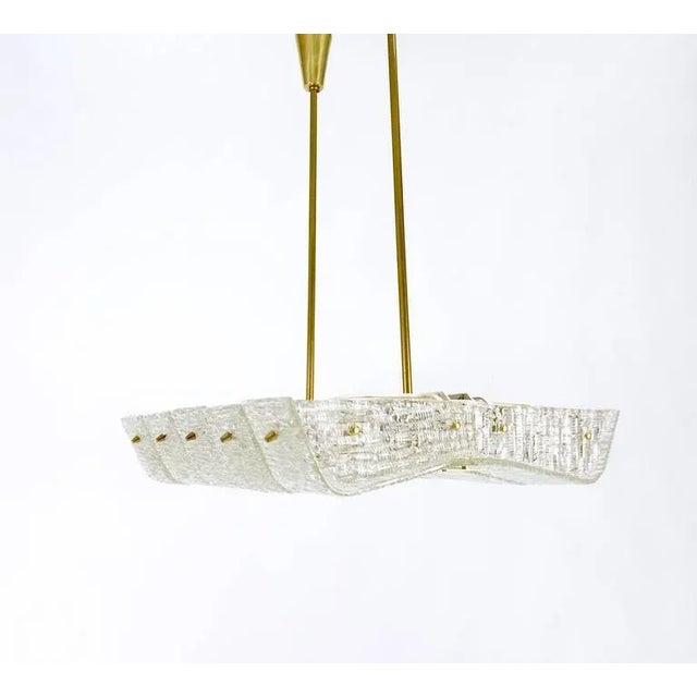 A beautiful and unusual square brass and glass chandelier on two rods, executed by Kalmar Vienna, Austria. Has a lovely...
