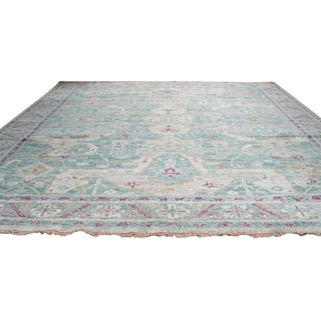 This Green hand knotted pile rug is crafted from high-quality silk and exemplifies the specific aesthetic of EORC Rugs....