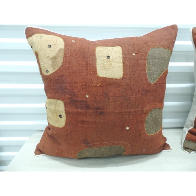 Applique African Raffia, Patchwork and Applique Brown Decorative Pillows. with, custom flat cotton trim in earth-tone...