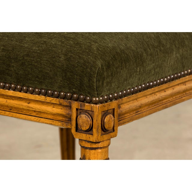 Sourced in Lyon, France, this set of ten late 19th-century Louis XVI dining chairs is crafted from fruitwood and showcases...