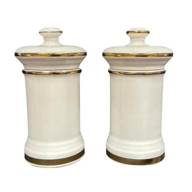 Decorative Vintage Apothecary/Pharmacy Jars with Lids. Each features a creamy ivory ground enriched with gilt trim, molded...
