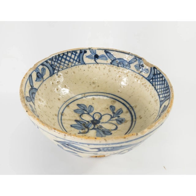 We are selling this very unusual Asian style bowl with blue and white decoration. The bowl is decorated in an early...