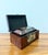 A handsome set of two vintage decorative keepsake boxes finished in a richly figured faux burl wood veneer with...