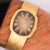 Audemars Piguet ellipse watch featuring slim 28mm cushion case in 18K yellow gold with champagne gradient dial and Roman...