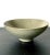 A Korean stoneware bowl from Goryeo dynasty circa 12th century. The conical form bowl with a small raised foot rim is...