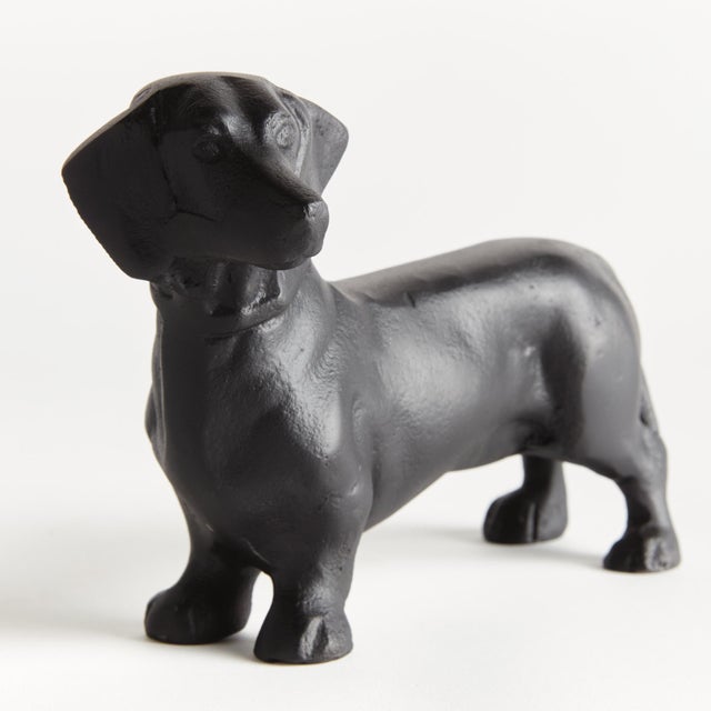 Made of a heavy cast aluminum using a centuries old sand cast method, this regal dachshund sculpture is worthy of a prime...