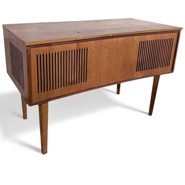 This mid century radiogram is a beautifully crafted vintage Alba radiogram console that combines classic British mid-...