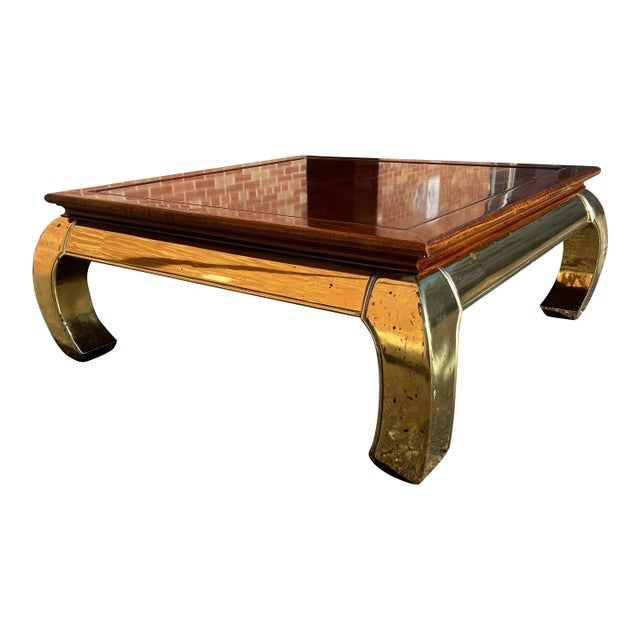 Asian inspired ming legged solid brass base coffee table having hardwood top, after Karl Springer, most likely...