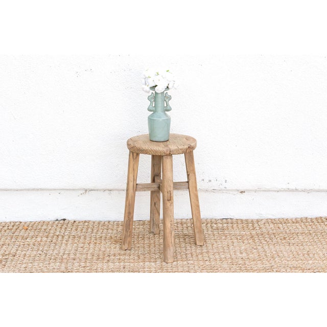 A rustic beauty, this weathered wooden round stool isn't just furniture; it's a whisper of the past. From the early 20th...