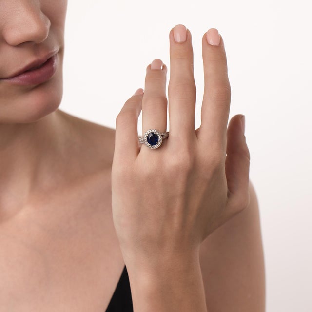 This elegant vintage sapphire and diamond ring is a polished design from the 2000’s, centered by a GIA-certified oval cut...